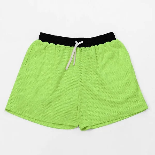 Man wearing black mesh quick-drying shorts for running or fitness training.
