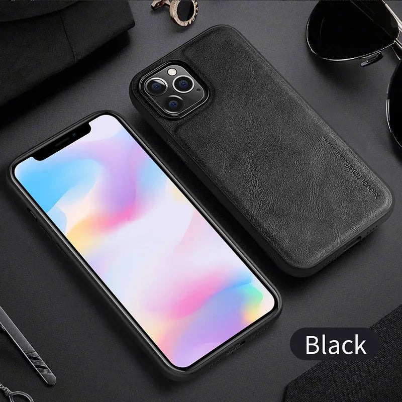 Black PU leather iPhone 12 phone case with soft TPU sides on a wooden table.