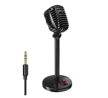 Black USB condenser microphone with stand, adjustable neck, and foam windscreen, placed on a desk