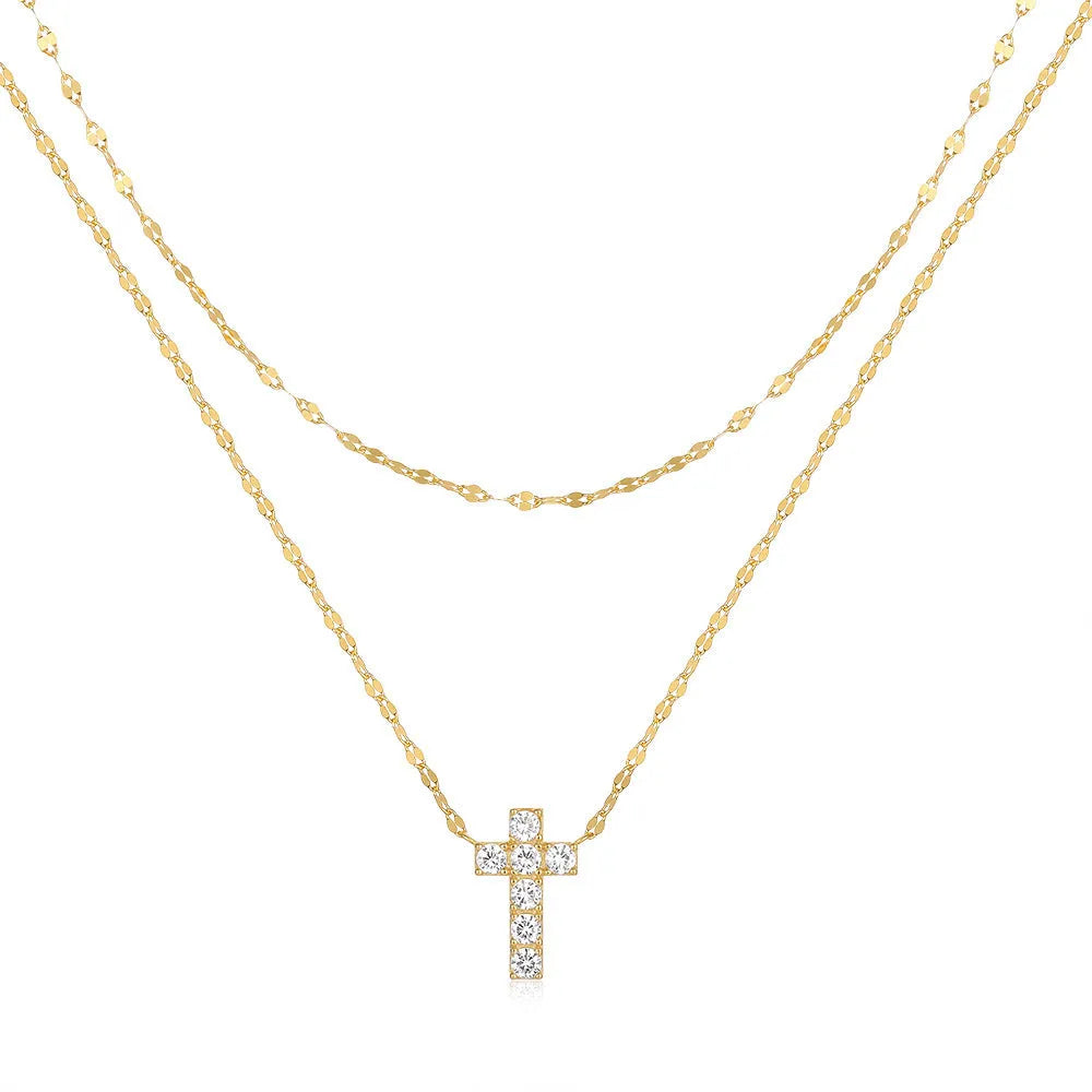 Sterling silver double layer cross pendant necklace with a clavicle chain in a gold tone finish.