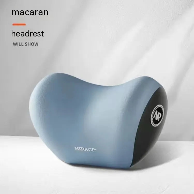 Black memory foam car lumbar support pillow and matching headrest pillow on a car seat.
