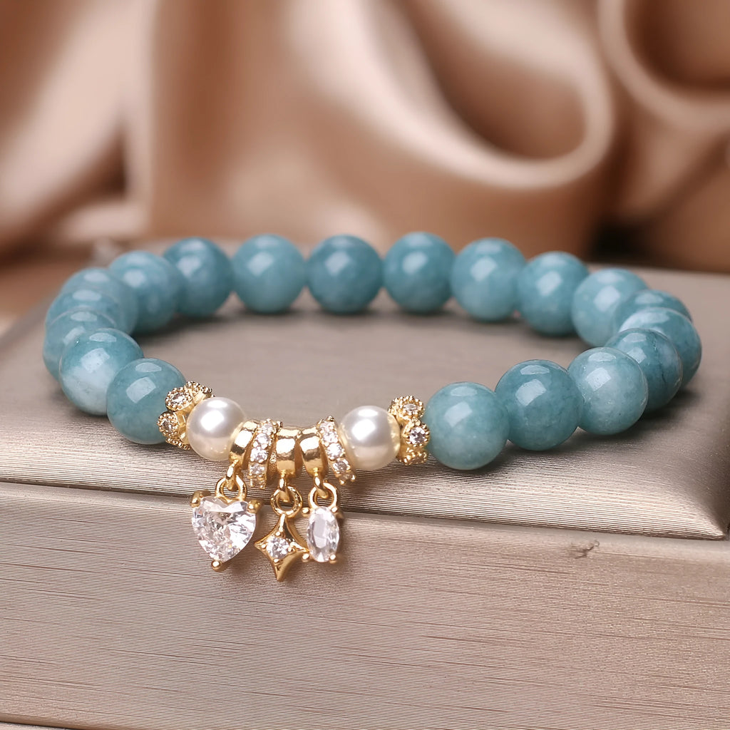 Blue water jade bracelet with heart-shaped zircon pendant and agate beads on display