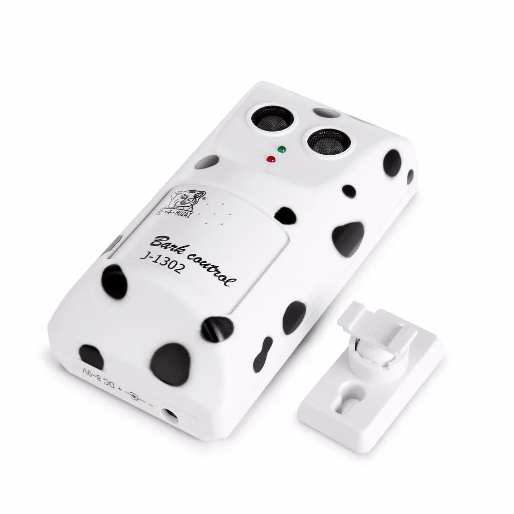 White anti-barking ultrasonic dog repeller mounted on a wall with rotary holder, 7x13x5cm