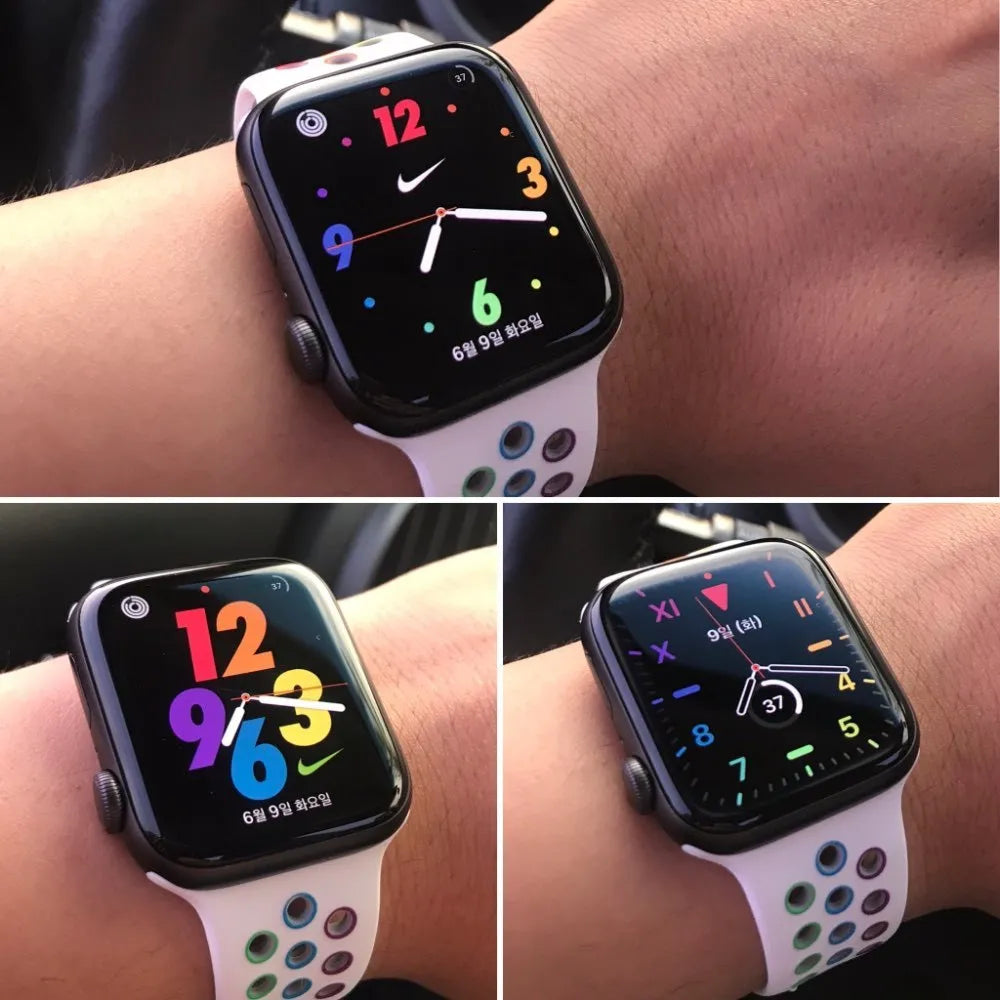 Silicone sports wristband with single buckle in black, rainbow, or white colours showing two size options
