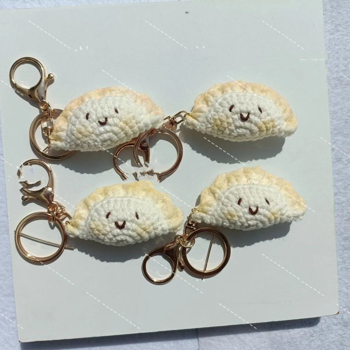 Handmade crochet dumpling pendant with plush texture and keychain in traditional festival design