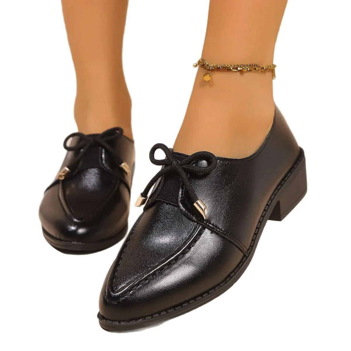 Women's simple flat shoes with a choice of bow decoration, showing PU upper and rubber sole.