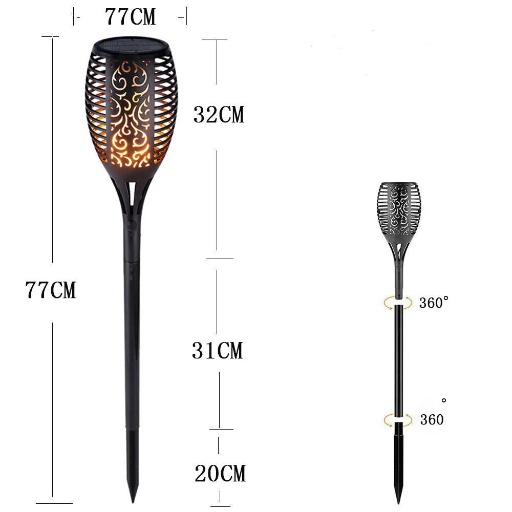 Black solar LED flame torch lamp with warm white flickering effect on a lawn, 83cm tall