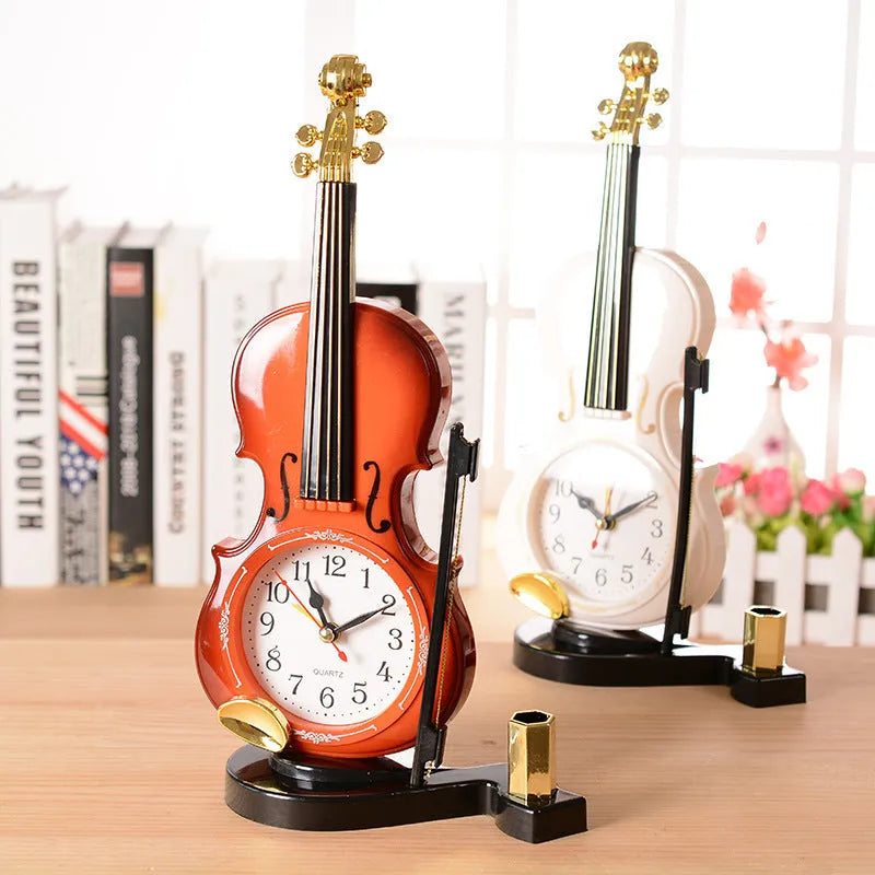 Brown plastic violin pen inserted alarm clock with quartz movement and LED display on a desk