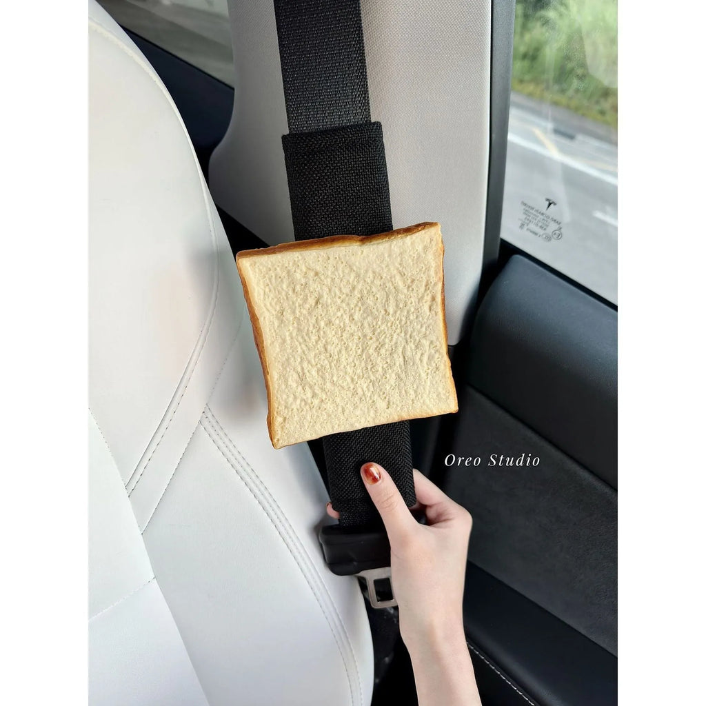 Toast bread safety belt shoulder pad in white toast colour on a car seat belt for driving comfort