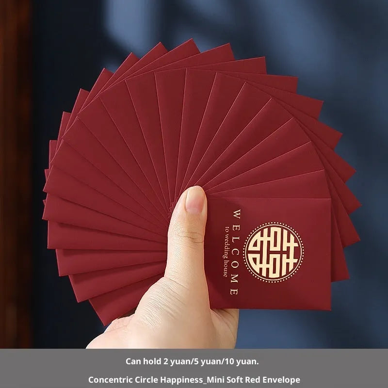 Pack of mini Chinese style wedding red packets in various colours for small cash gifts