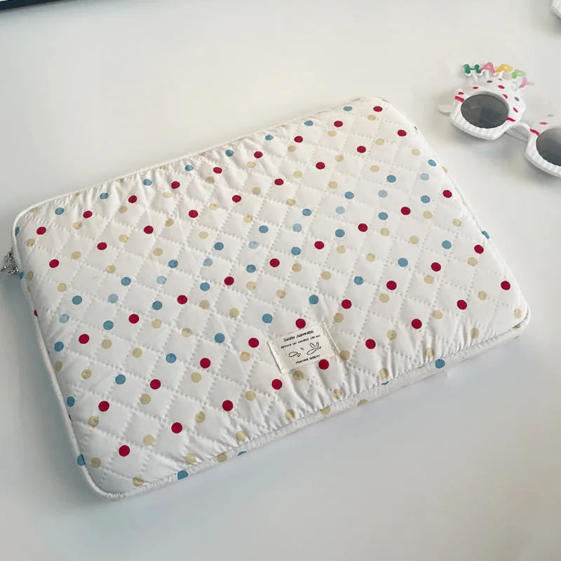 Women's polka dot polyester laptop bag showing front view with storage compartments