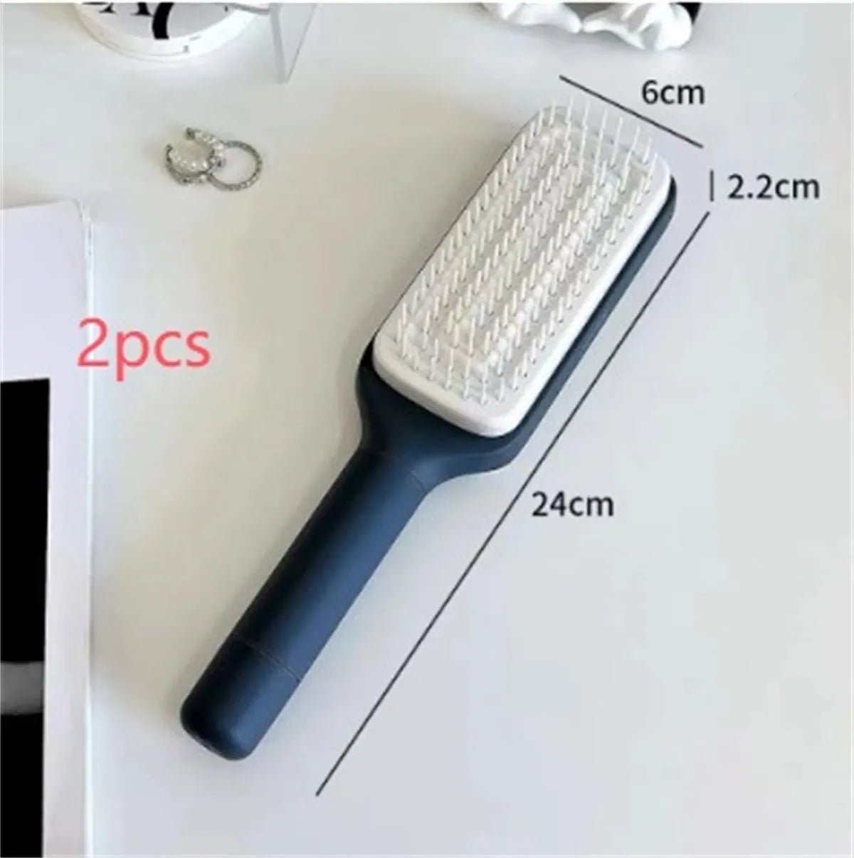 Roland purple self-cleaning hairbrush with rotating handle and anti-static massage teeth