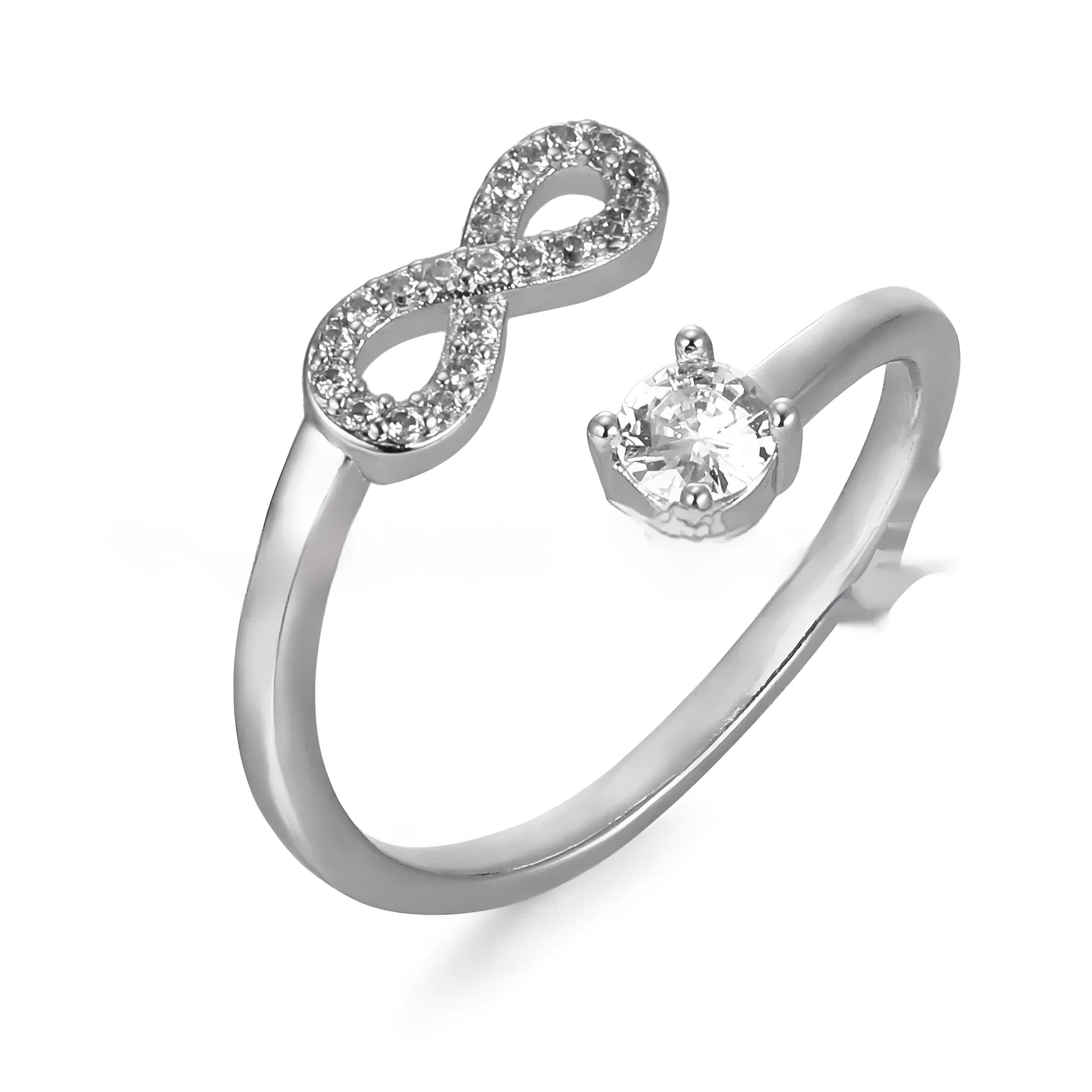 Gold metal open ring with diamond zircon letter design on a plain background