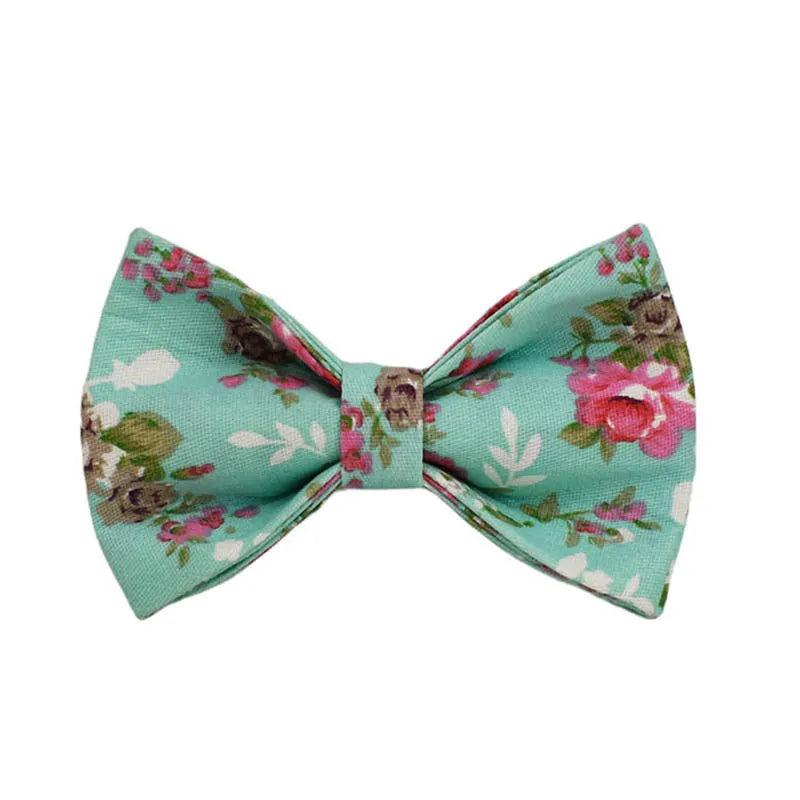Rose print dog collar set with green background including collar, leash, detachable bow, and vest
