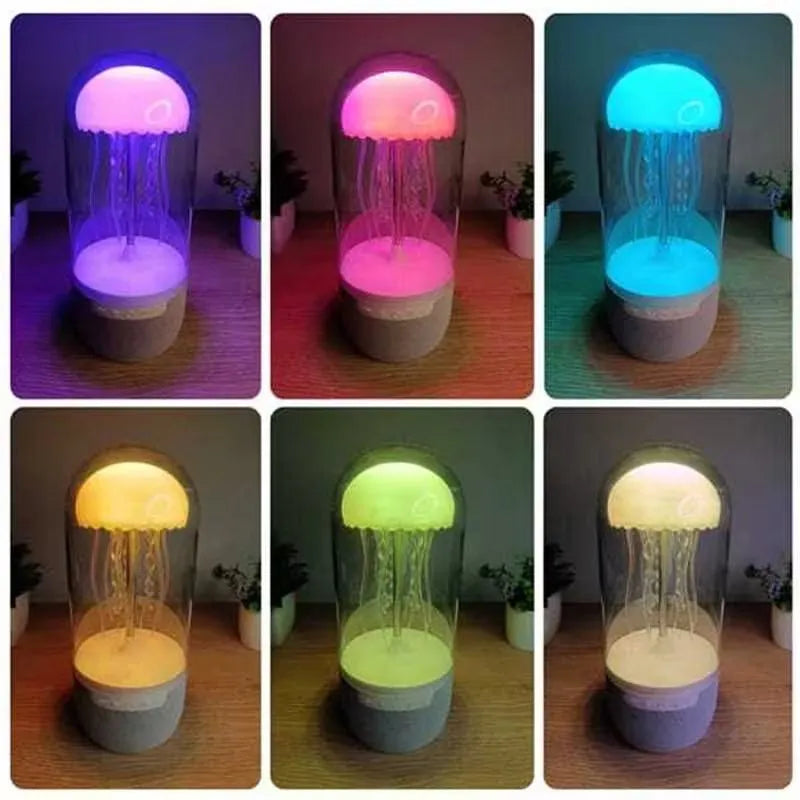 White compact 3-in-1 Bluetooth speaker jellyfish lamp with LED colour lights on a desk