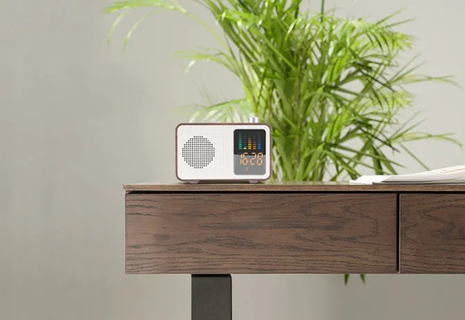 Brown vintage-style portable Bluetooth and FM radio speaker with wooden-effect casing.