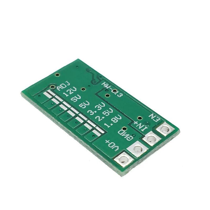 Green mini DC-DC step down power module converting 12-24V to 5V 3A output.