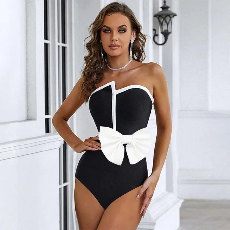 Women's black and white colour-block one-piece swimsuit with irregular tube top and bow detail