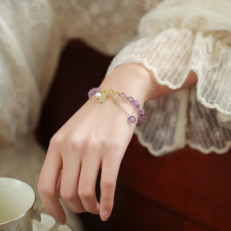 Natural crystal women's bracelet with lavender amethyst stones and animal/Zodiac motif in dark and light colour variations