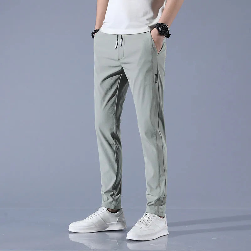 Men's summer ice silk stretch straight sports trousers in loose fit with drawstring, available in black, dark gray, light gray, light green