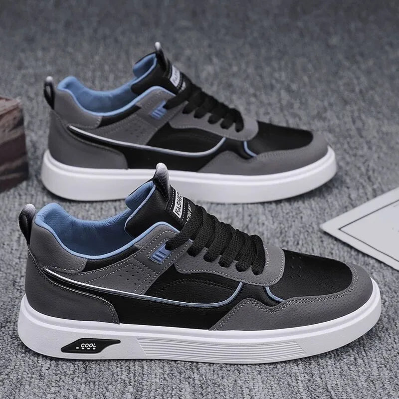 Men's low-top canvas board shoes in beige with leather stitching detail on a white background.