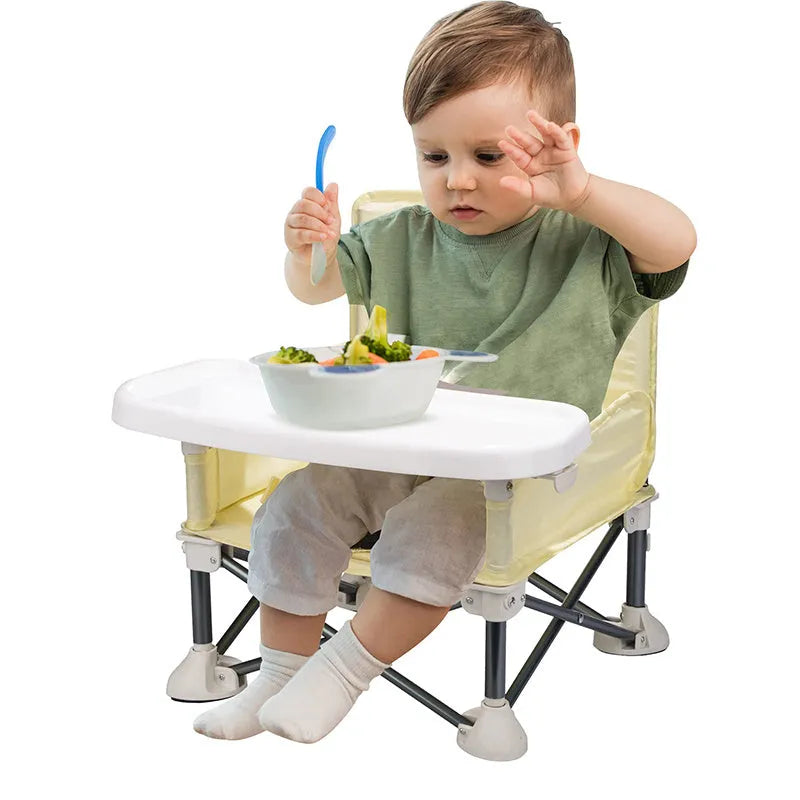 Foldable baby dining chair with safety belt, removable tray, and storage bag in pink