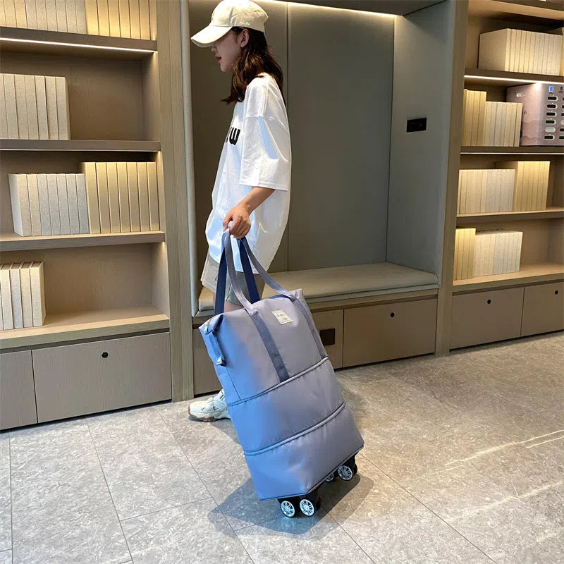 Blue large-capacity travel bag with omnidirectional wheels and Oxford cloth exterior