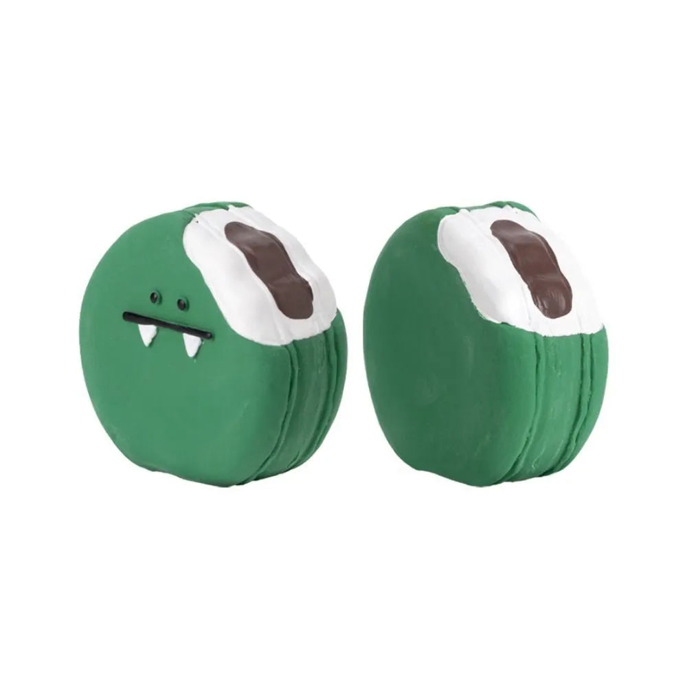 Green and yellow egg-shaped latex dog toy with cartoon bread pattern and squeaker