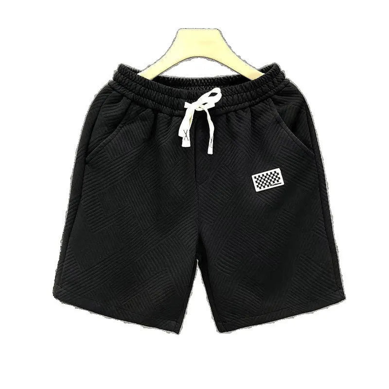 Men's casual sports shorts in polyester fabric showing elastic waistband and solid colour options