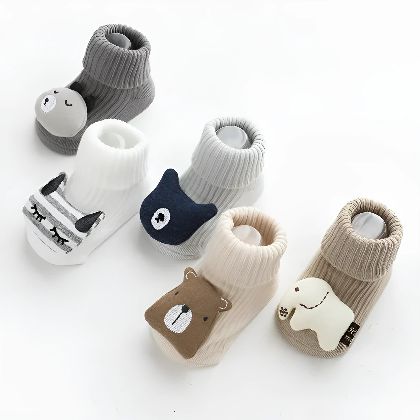Baby socks with non-slip rubber grip soles on the feet, shown in a light grey colour.