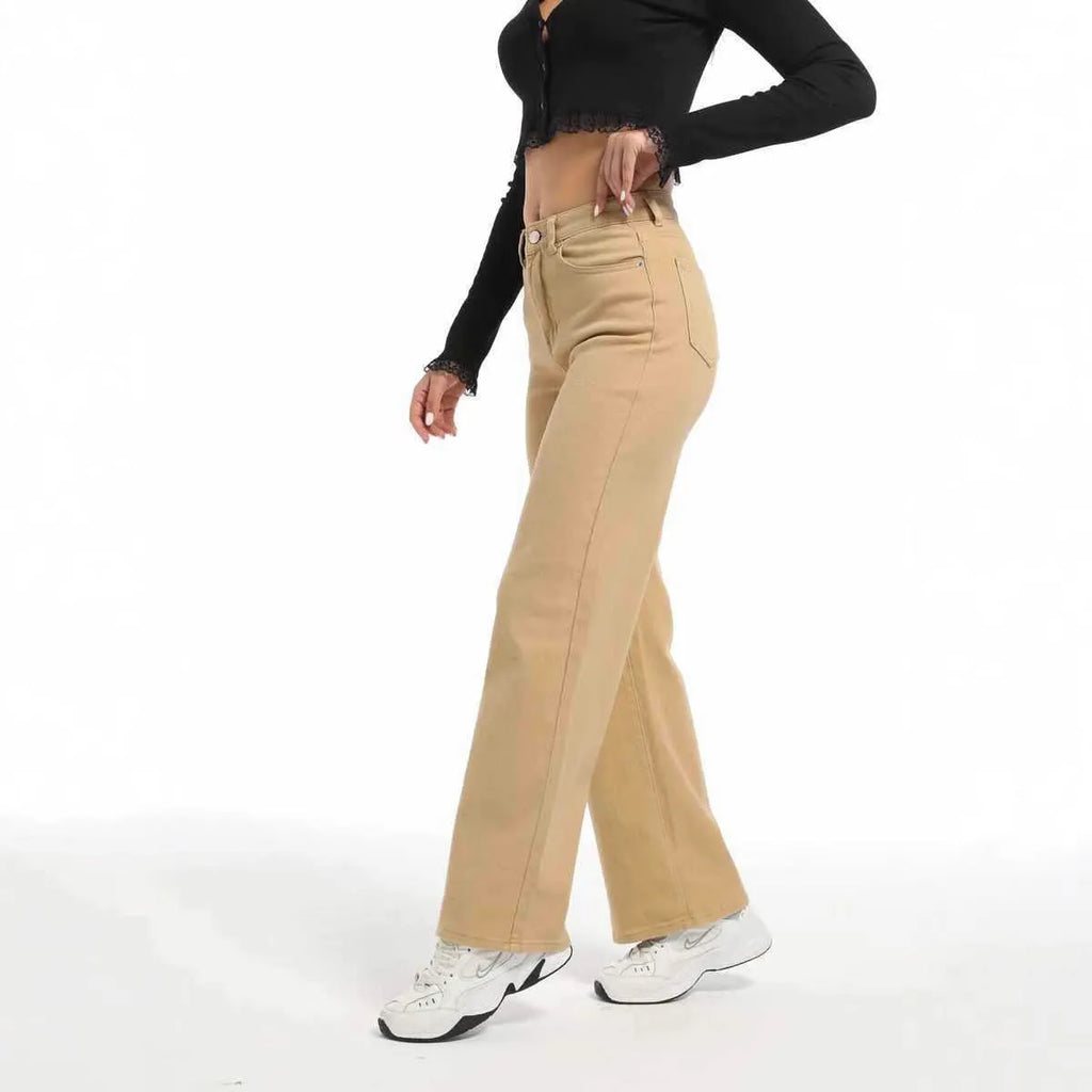 Women's high-waist straight leg cotton trousers in apricot colour, showing wide-leg silhouette.