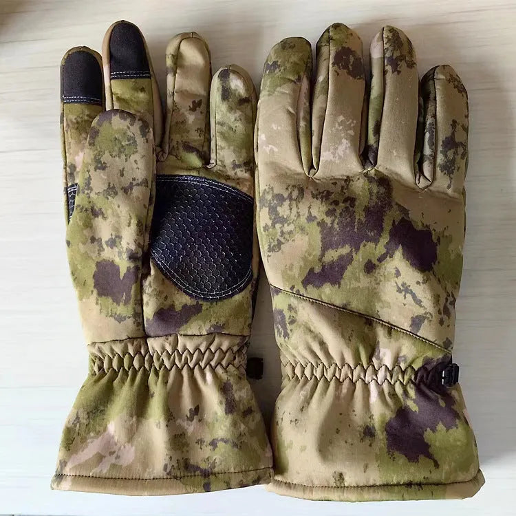 A pair of tactical camouflage winter ski gloves with touch screen fingertips on a neutral background.