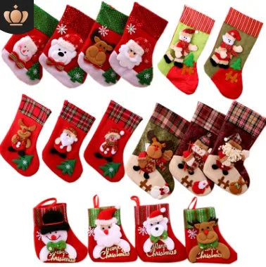 Red cloth Christmas sock with sequin detail hanging on tree branch