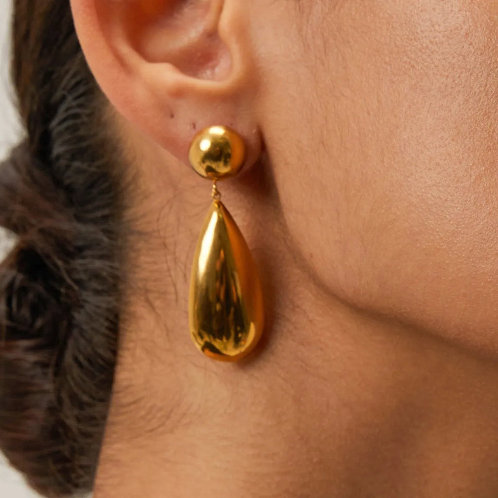 Gold stainless steel water drop pendant earrings with geometric hemisphere design elements