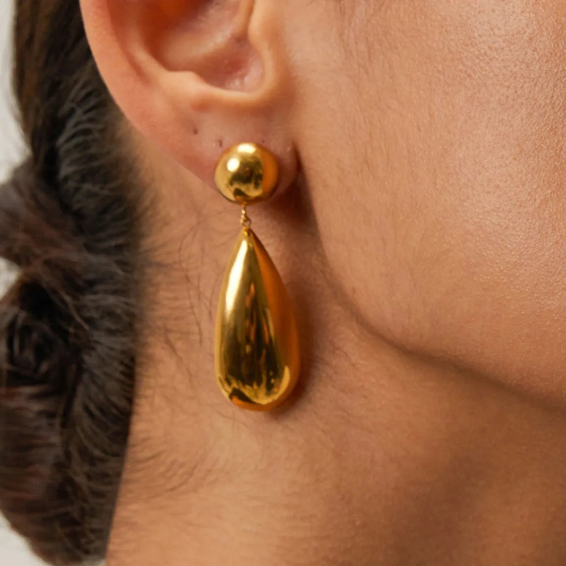 Gold stainless steel water drop pendant earrings with geometric hemisphere design elements