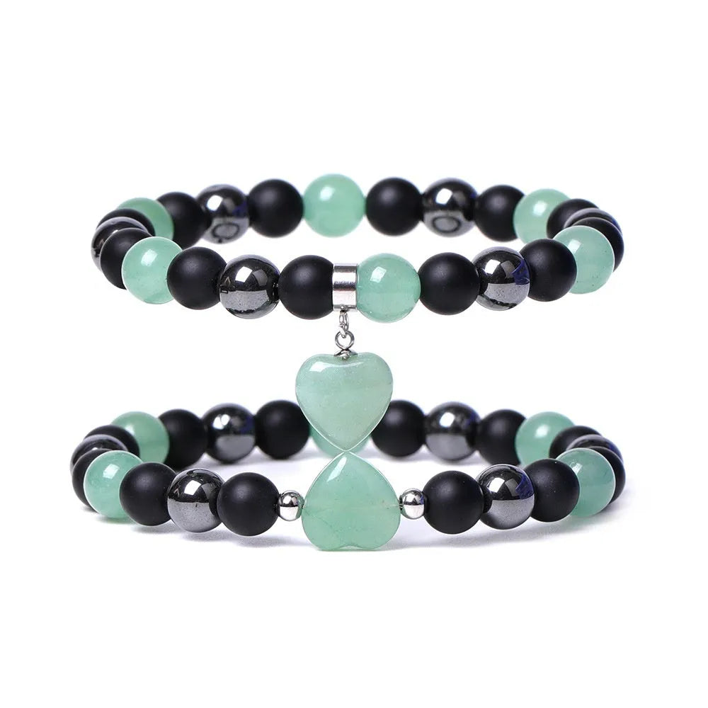 Hand-cut peach heart stone bracelet with geometric universe and moon design in various colours.