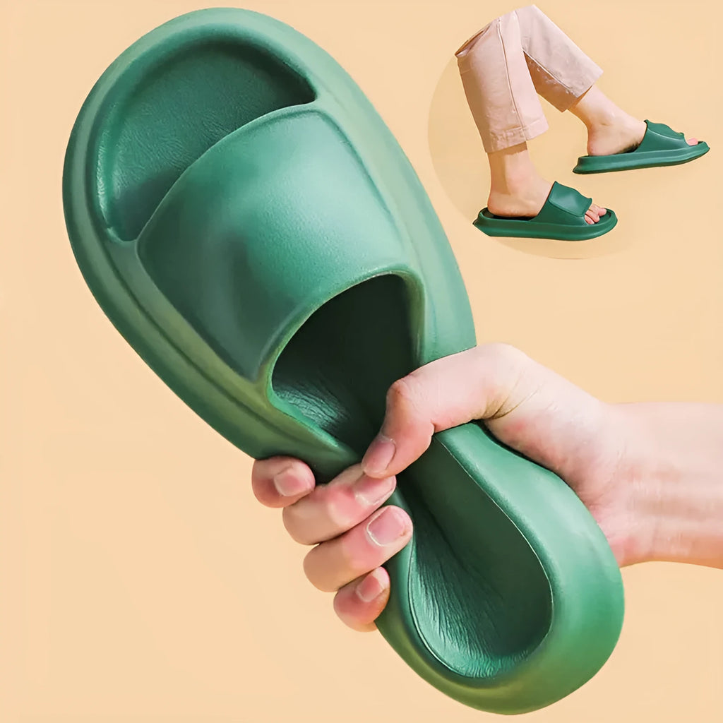 Pair of thick-soled EVA flip-flop slippers in a choice of seven colours, shown on a wet bathroom floor.