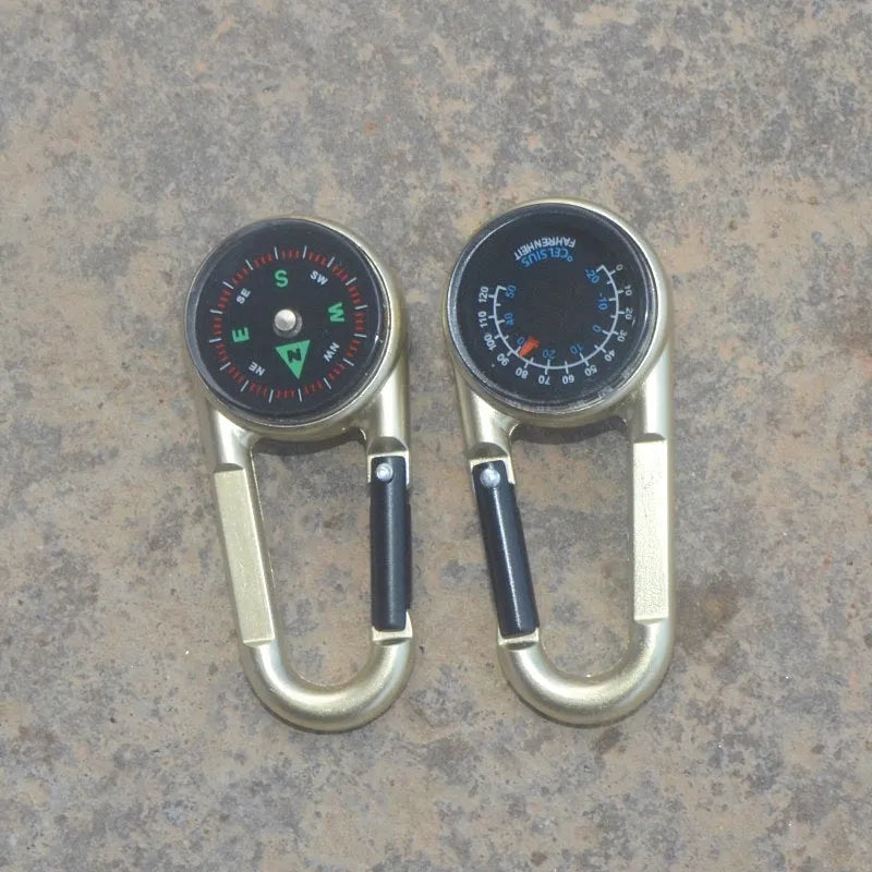 Army green zinc alloy outdoor carabiner with built-in fluid compass and liquid thermometer showing temperature scale