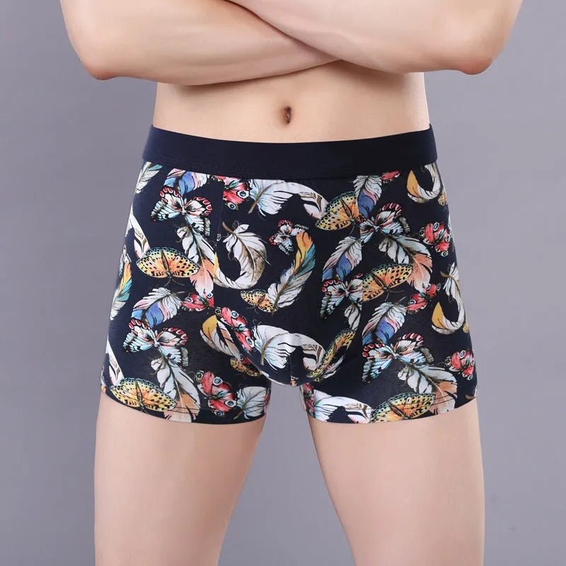 Men's floral print cotton boxer shorts showing the U-shaped pouch design and available colour variations.