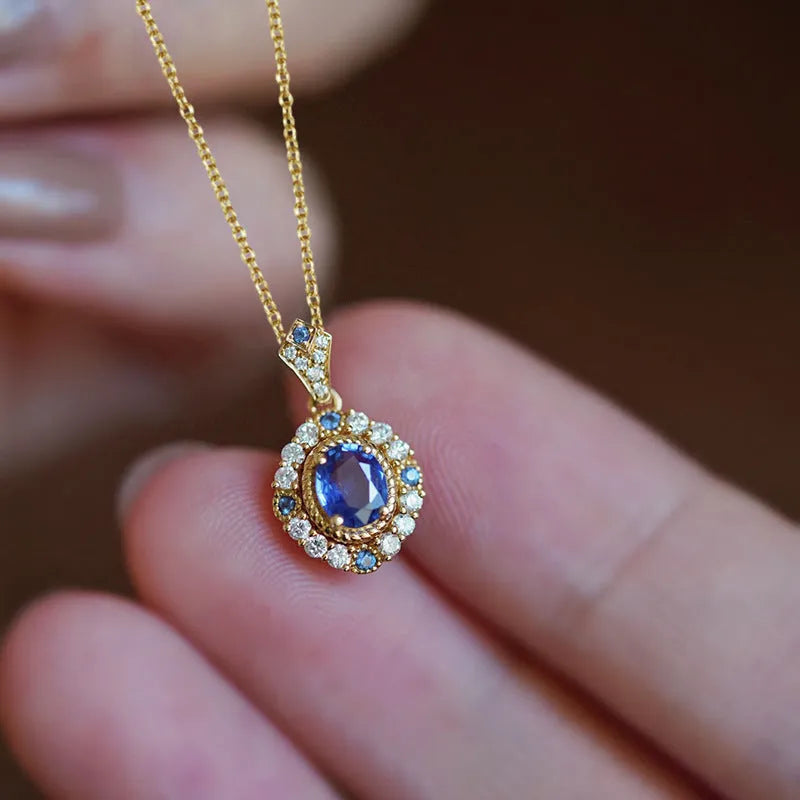 Yellow gold plated women's necklace with mixed gem pendant on an adjustable box chain.