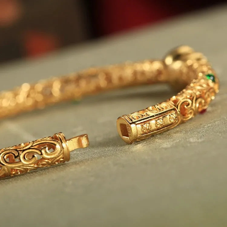 Women's gold-plated silk bracelet with adjustable knot and traditional Chinese xiangyun gourd charm