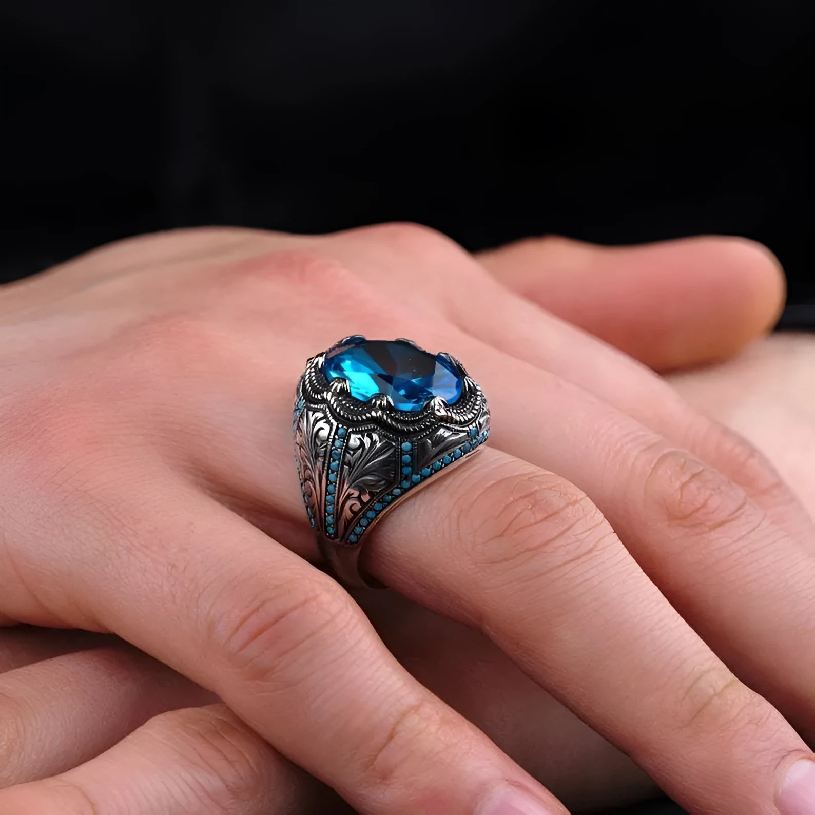 Geometric antique silver alloy ring with blue zircon stone showing European American styling