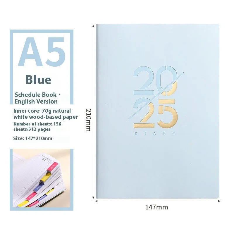 A5 daily planner notebook with soft faux leather cover in blue, lying open on a table.