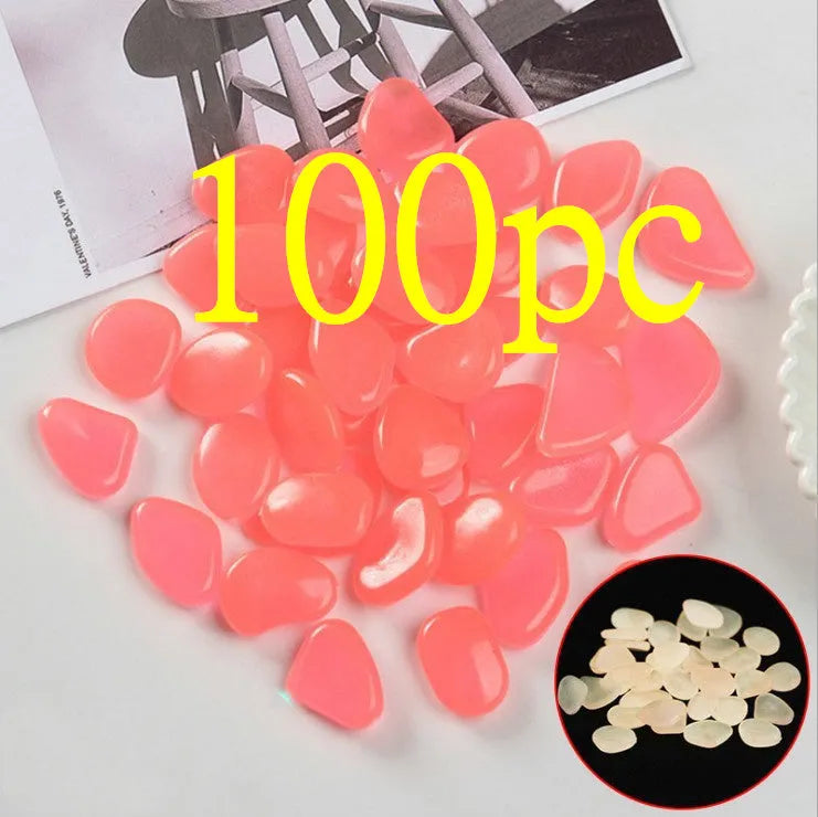 Luminous fluorescent aquarium and garden pebbles in mixed colours including dark purple, yellow, light blue, pink, orange