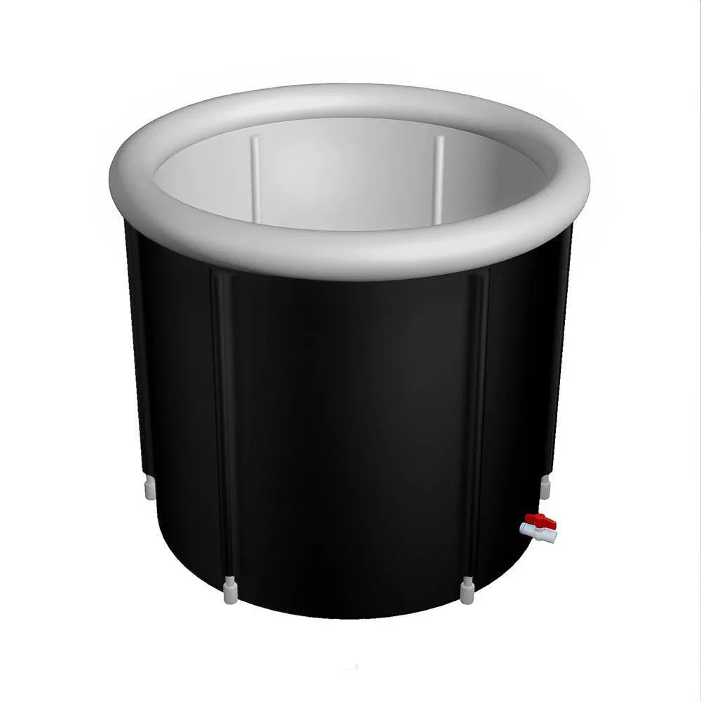 Black inflatable portable ice bath tub with weather lid, shown outdoors.