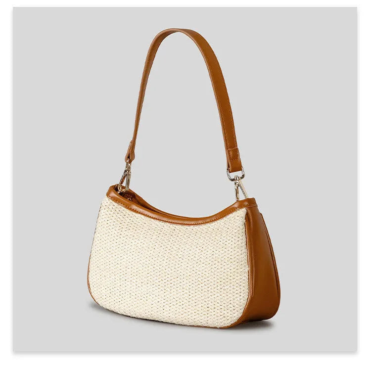 Khaki hand-woven straw crossbody bag with single shoulder strap showing textured PP grass construction