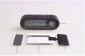 Black electronic car clock and thermometer with luminous digital display on an adjustable dashboard mount.