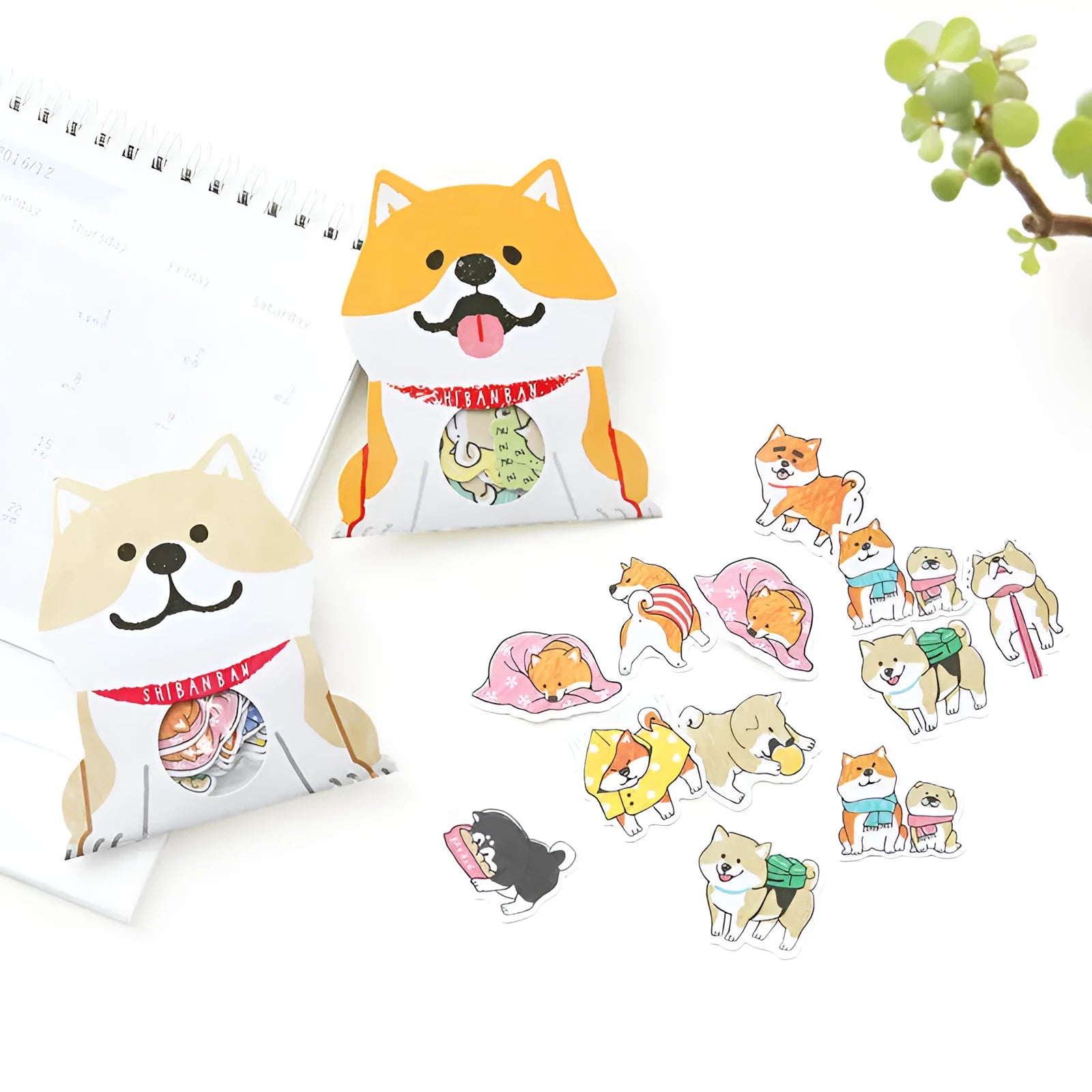 Pack of irregular-shaped dog-themed stickers in black, light brown, and orange colours for journal decoration.