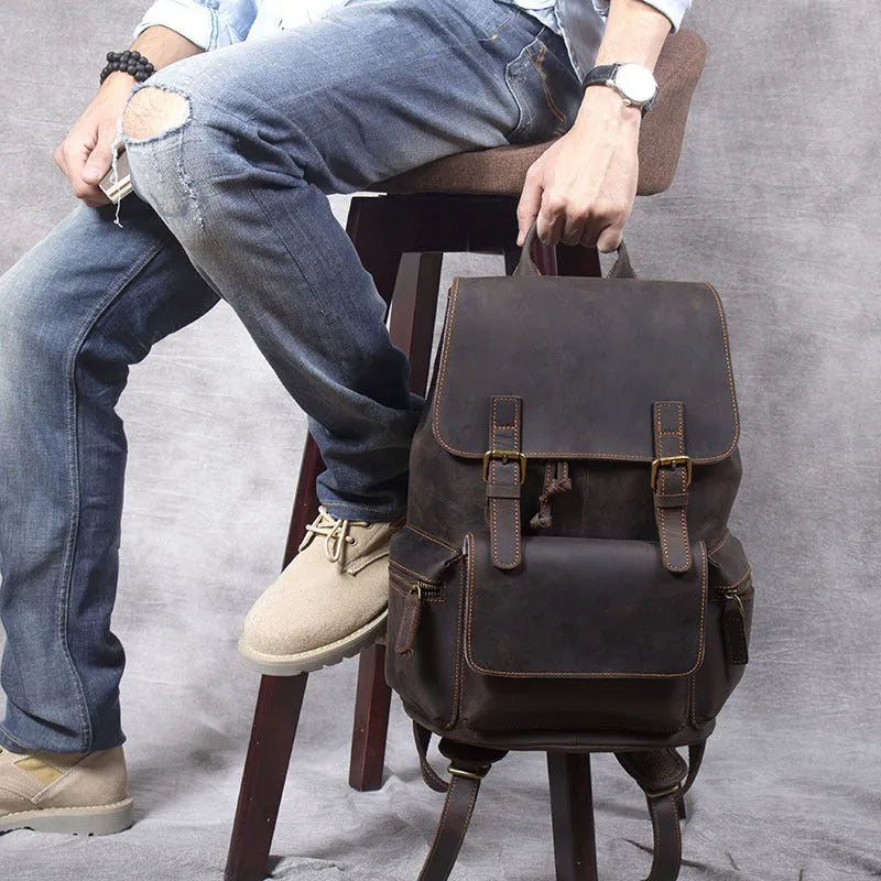 Brown genuine cowhide leather backpack with double shoulder straps and soft handle