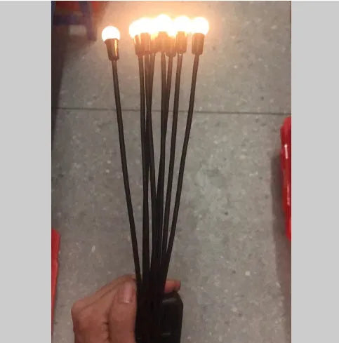 Solar-powered LED garden light with ground spike for soil installation in warm white or coloured lighting options